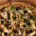Grain-free Cauliflower Pizza Crust Recipe Topped with Black Olives and Artichokes Grain-free Cauliflower Pizza Crust Recipe Topped with Black Olives and Artichokes