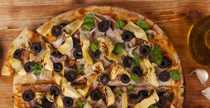 Grain-free Cauliflower Pizza Crust Recipe Topped with Black Olives and Artichokes 